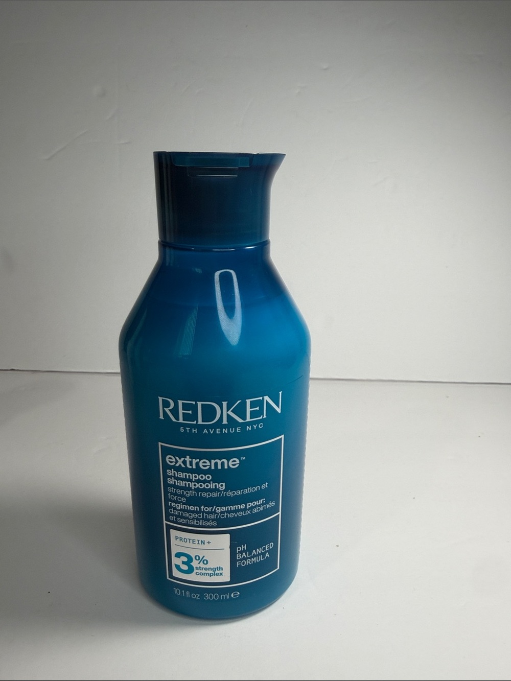 Redken Extreme Strength Shampoo — Deep Teal Bottle